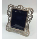 An attractive silver pierced picture frame decorat
