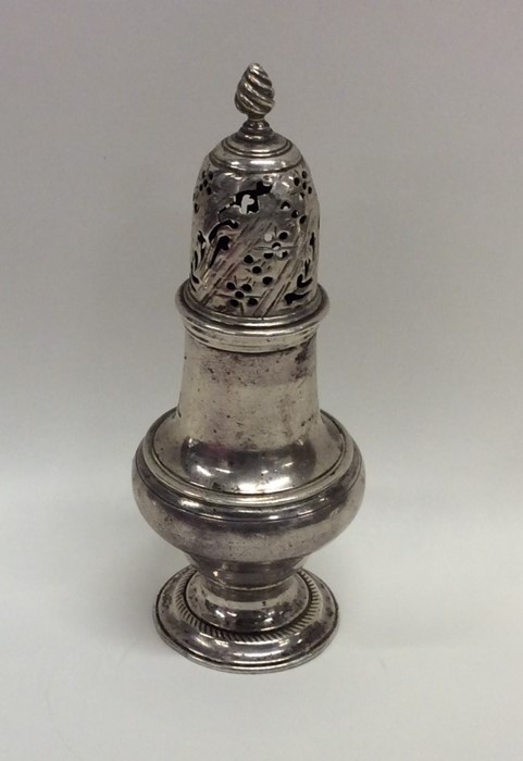 A Georgian silver baluster shaped sugar caster. Lo