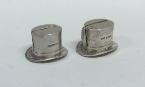 A pair of novelty silver menu holders in the form