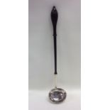 A good Georgian silver toddy ladle with turned woo