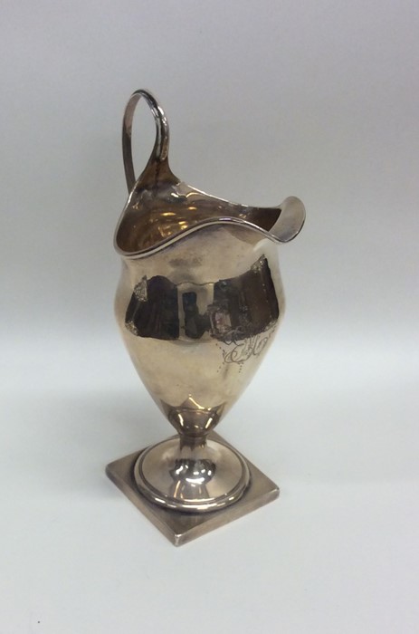 A large Georgian silver Adams' style cream jug. Lo