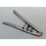 An unusual pair of silver mounted cigar cutters. 9
