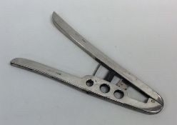 An unusual pair of silver mounted cigar cutters. 9