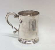 A good quality Georgian silver mug on spreading su