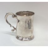 A good quality Georgian silver mug on spreading su