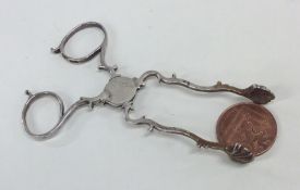 A pair of Georgian silver sugar scissors with shel