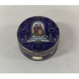 A Continental silver and enamel pill box decorated