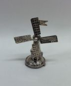 A novelty model of a windmill. Approx. 16 grams. E