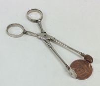 A pair of Georgian silver sugar scissors of typica