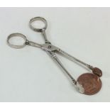 A pair of Georgian silver sugar scissors of typica