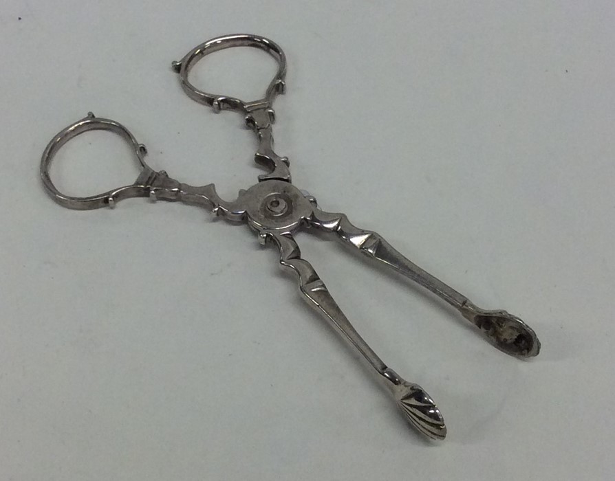A pair of Georgian silver sugar scissors with shel