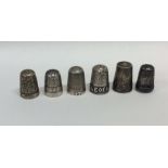 An Isle of Man silver thimble together with five o