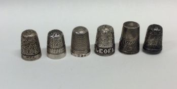 An Isle of Man silver thimble together with five o