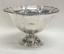 A heavy fluted silver sweet dish on pedestal base.