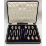 A boxed set of twelve silver coffee spoons togethe
