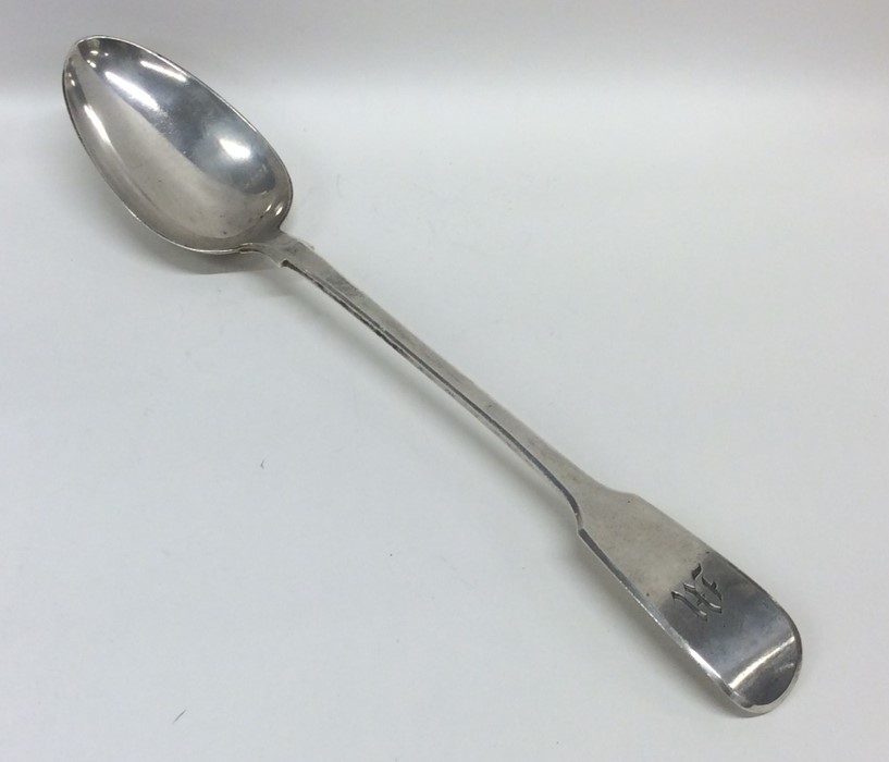 A heavy fiddle pattern silver basting spoon engrav