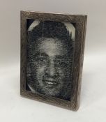 An engine turned rectangular silver picture frame.