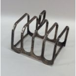 An Edwardian silver toast rack / smartphone dockin