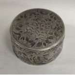 A circular Islamic pill box attractively decorated