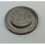 A rare circular squat silver wafer box with crimpe