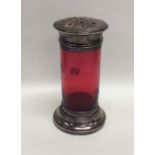 A cranberry glass sugar caster with silver mounts