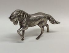 A heavy silver model of a horse with textured body