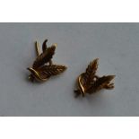 A pair of 9 carat earrings in the form of leaves.