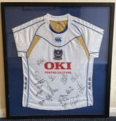 A framed and glazed Portsmouth FC signed shirt. Es