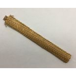 A heavy French 18 carat gold mesh bracelet with co