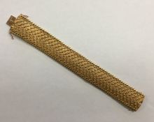 A heavy French 18 carat gold mesh bracelet with co