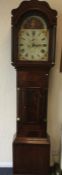 A mahogany grandfather clock with painted dial and