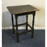 An Antique oak side table with stretcher base. Est