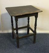 An Antique oak side table with stretcher base. Est