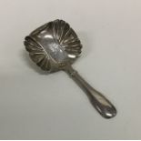A Georgian silver fiddle pattern caddy spoon. Lond