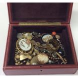 A box containing lockets, stick pins etc. Est. £30