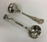 EXETER: A pair of Kings' pattern silver sauce ladl