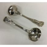 EXETER: A pair of Kings' pattern silver sauce ladl