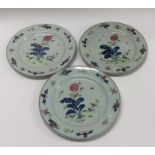 A set of three Famille Rose plates decorated with