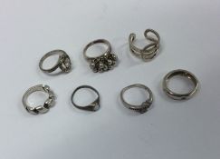 A collection of seven silver mounted rings. Approx