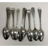 A bag containing ten picture back silver teaspoons