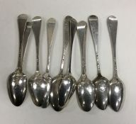 A bag containing ten picture back silver teaspoons