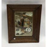 A Victorian oak framed and glazed memory picture.