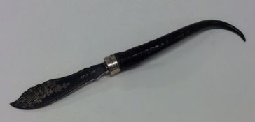 An Edwardian silver paper knife with horn handle.