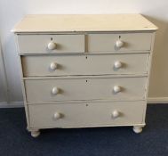 A painted pine chest of five drawers. Est. £50 - £