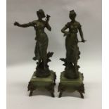 A pair of tall spelter vases. Est. £15 - £20.