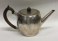 An Irish Georgian silver teapot of plain form with