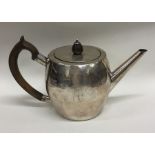 An Irish Georgian silver teapot of plain form with