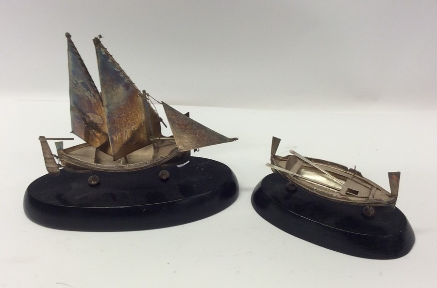 Two Continental silver model Maltese boats on oval