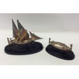 Two Continental silver model Maltese boats on oval