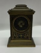 A good brass mantle clock attractively decorated w